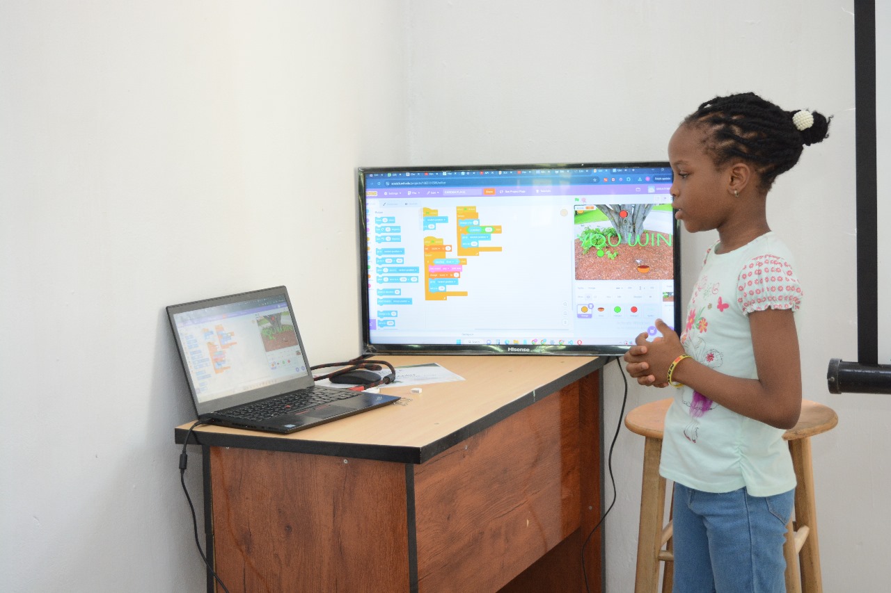 Young learners showcasing coding projects at Toko Academy