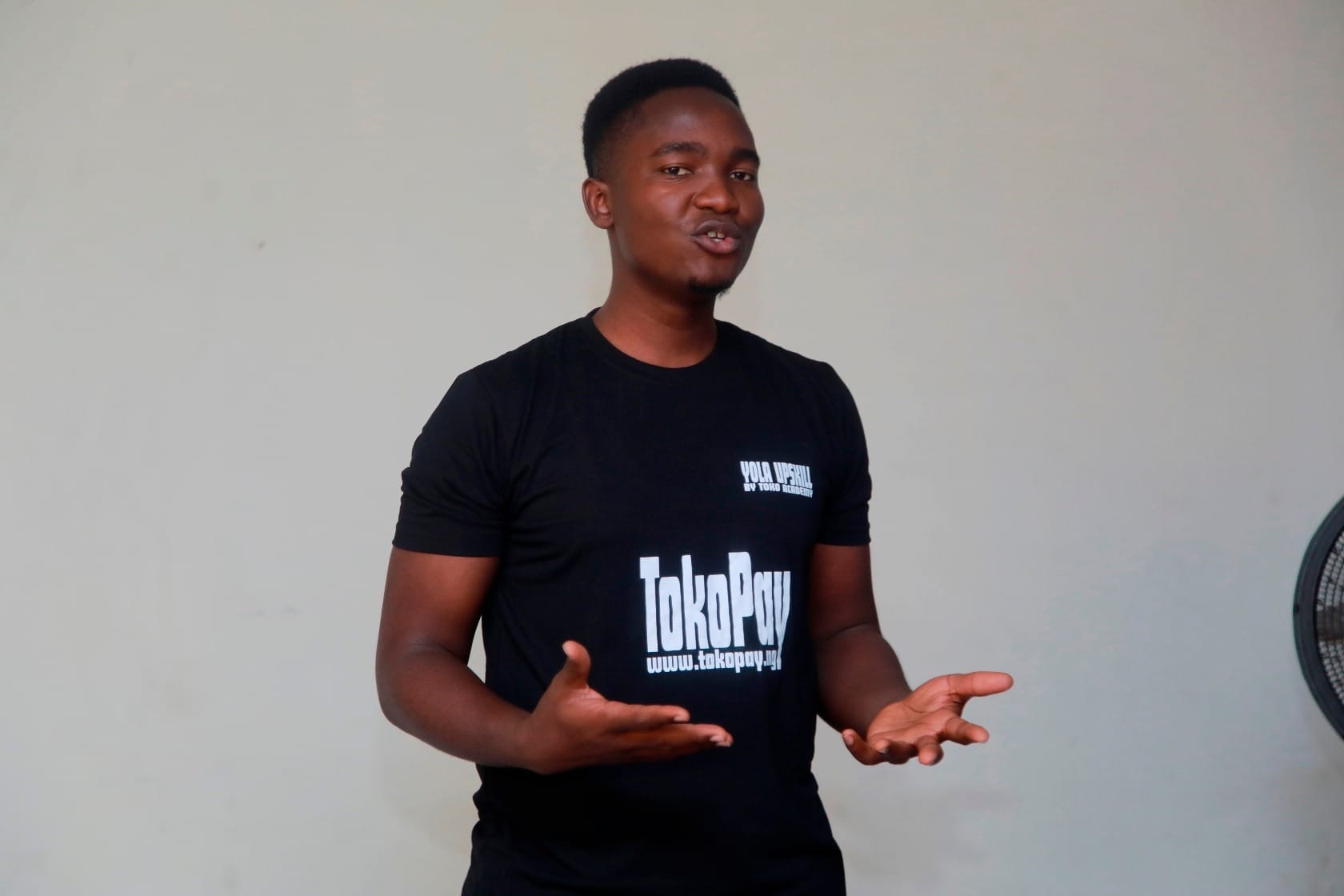 Daniel Ishaku, founder of Toko Academy, speaking at a training event